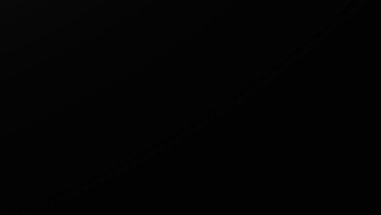 Abstract black background with subtle gradient.