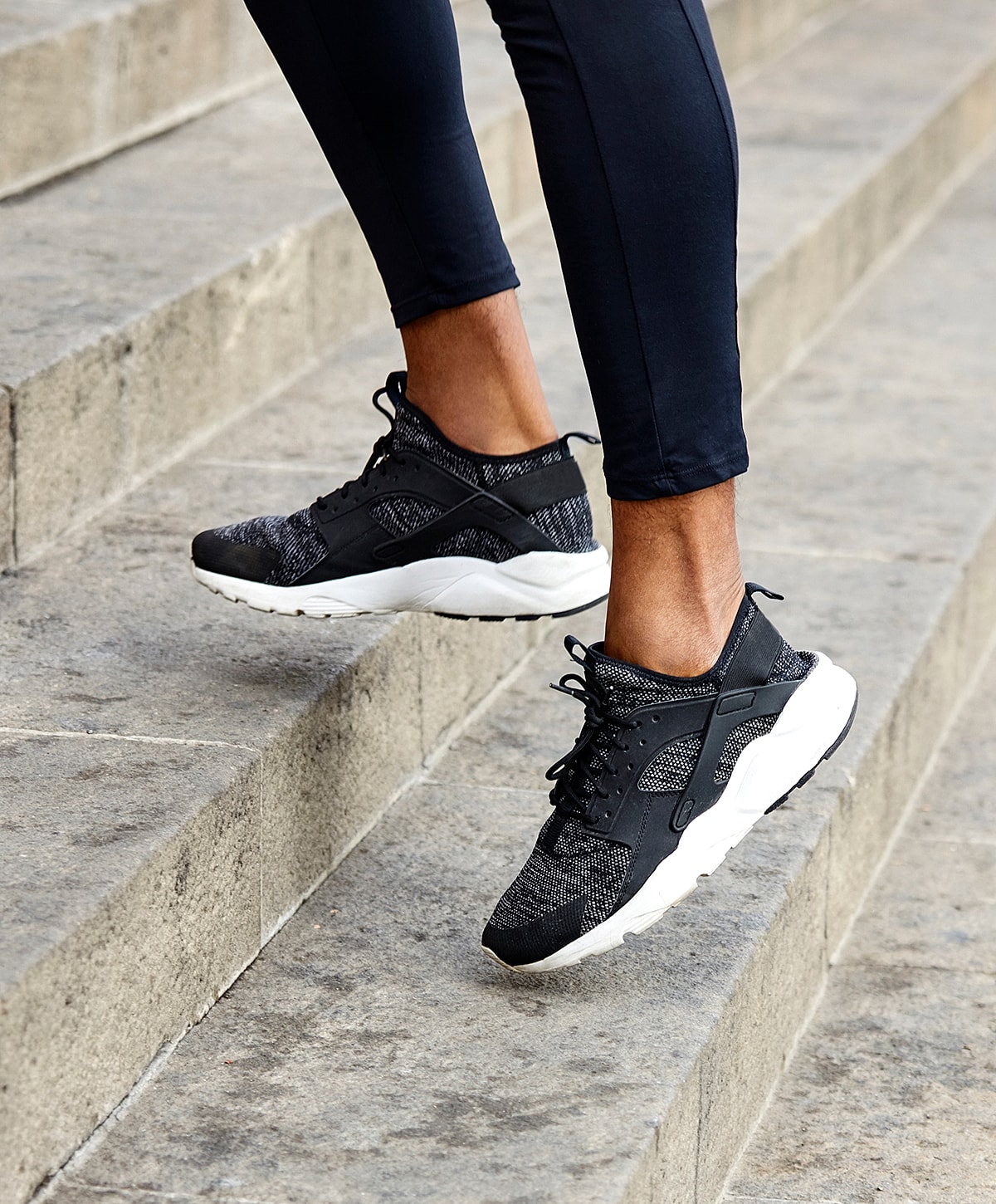 Stylish outfit featuring black heels and handbag.