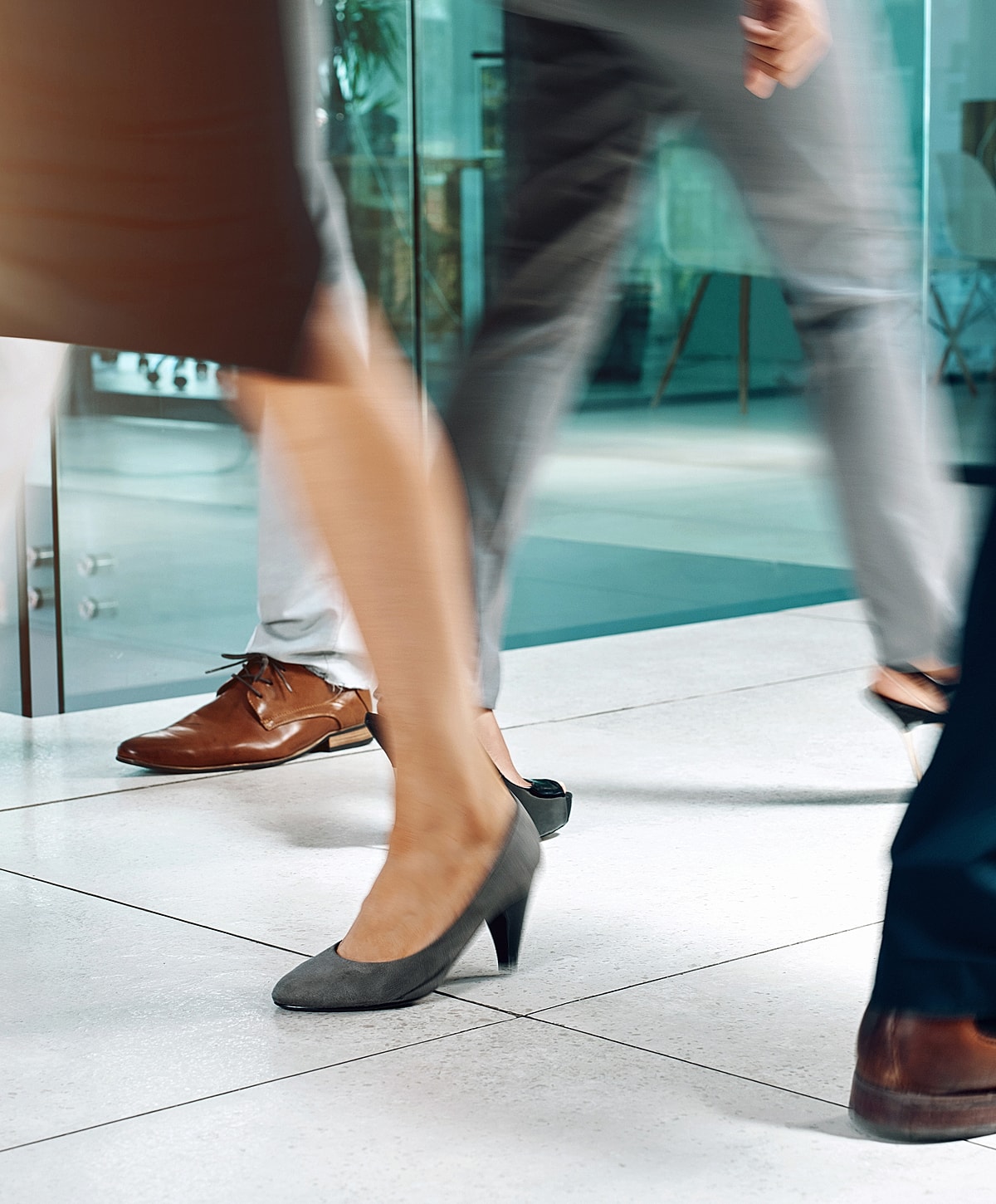 Woman adjusting her black high heel shoe.