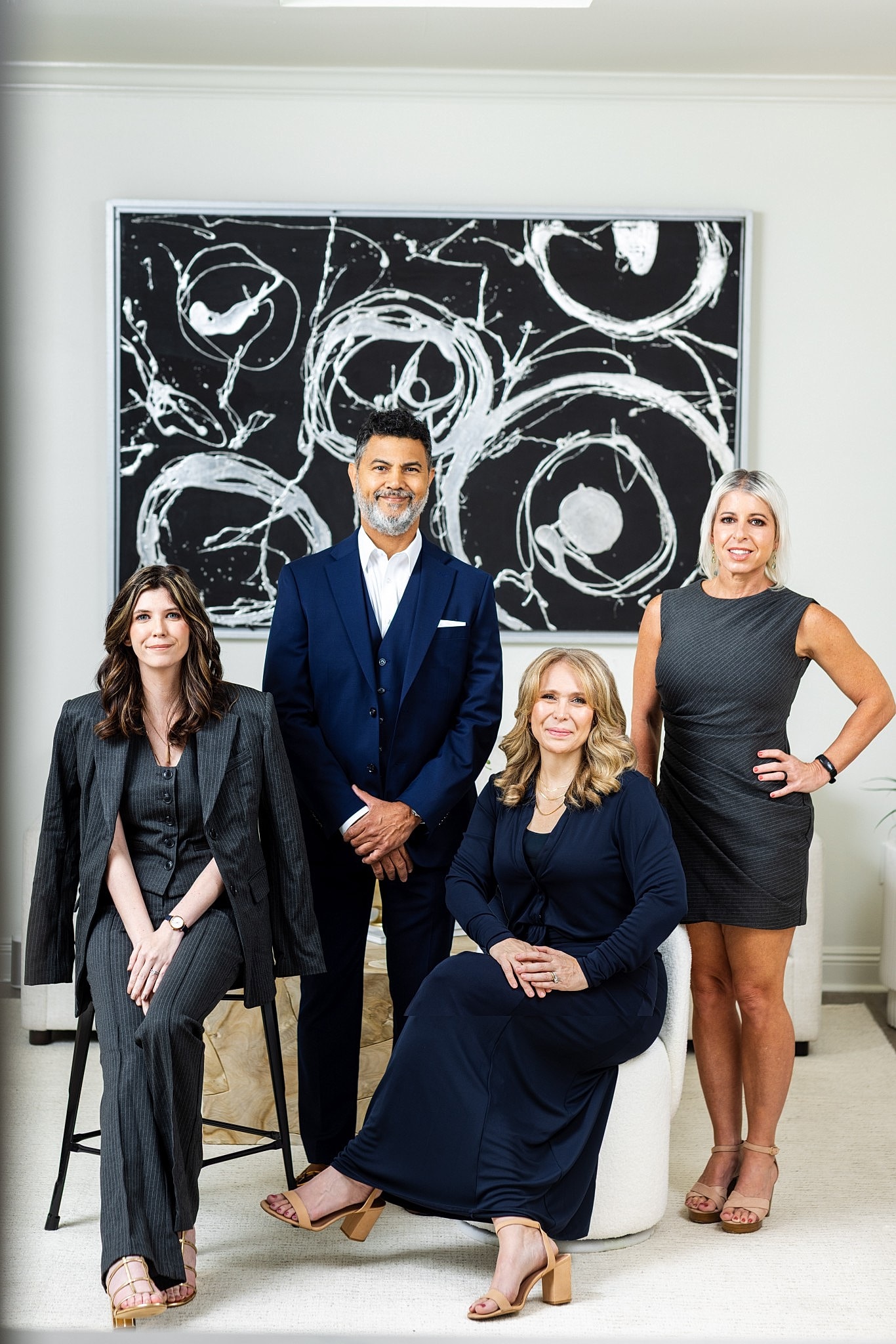 Group portrait in modern professional attire.