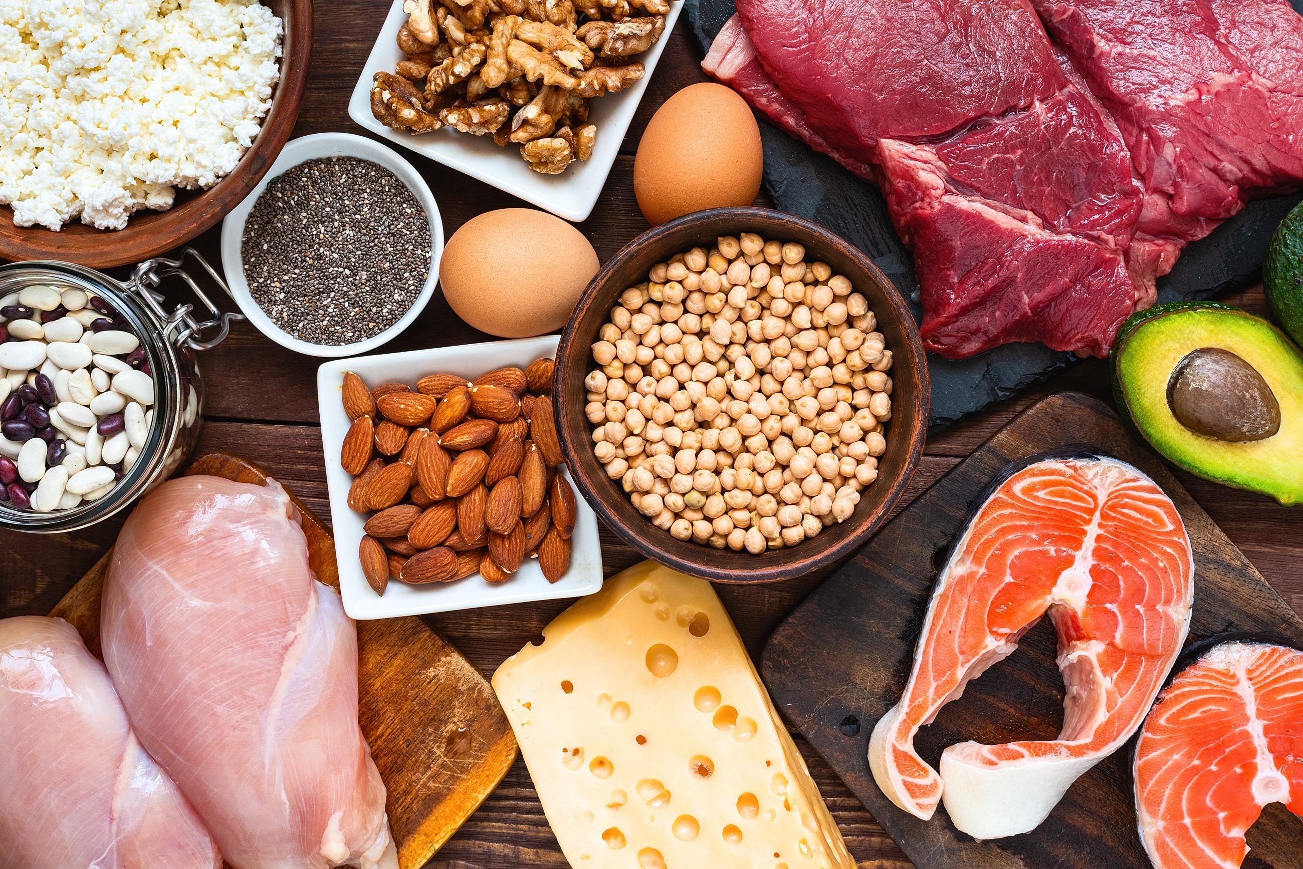 Assorted healthy foods on a wooden table.