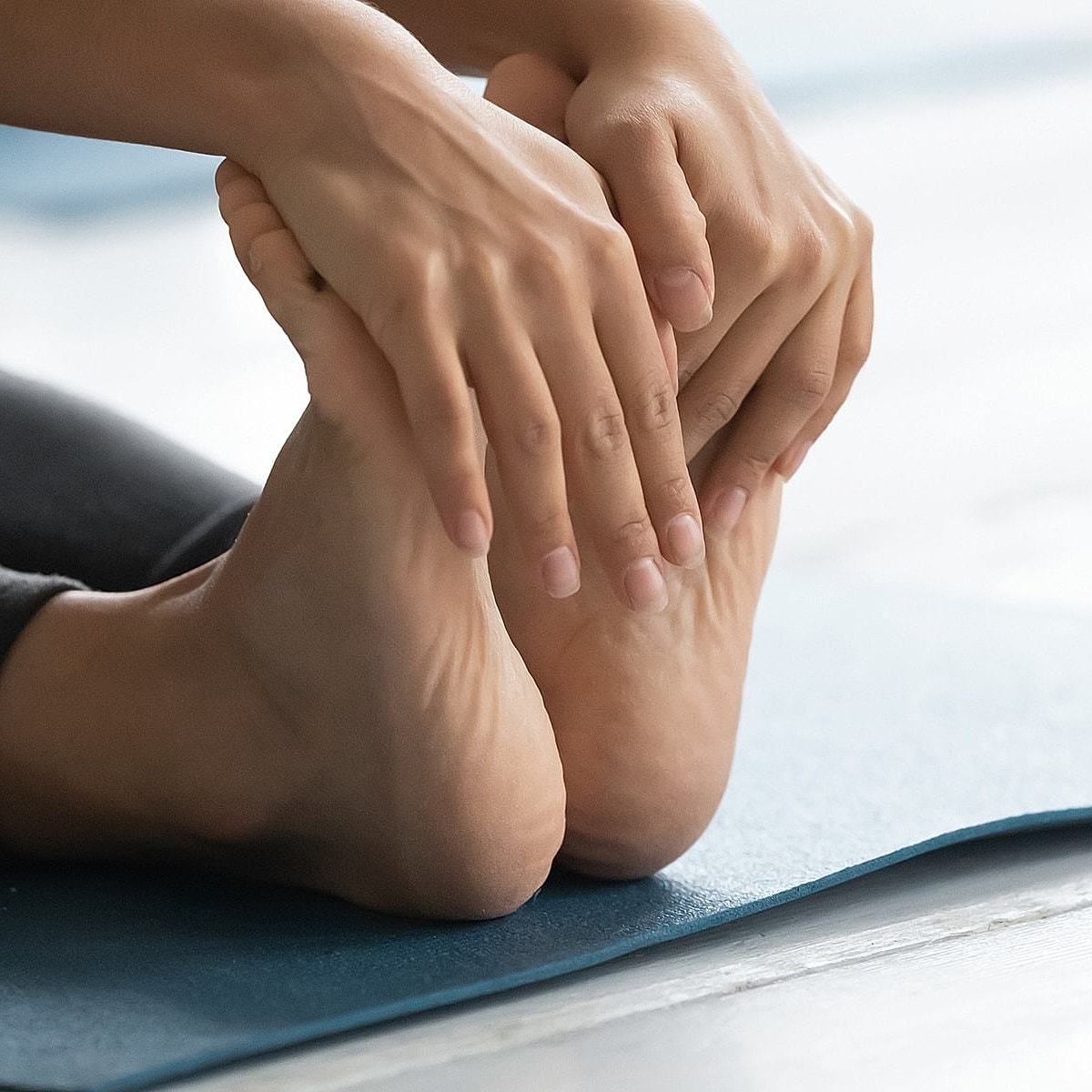 Adjusting athletic shoes before exercise.