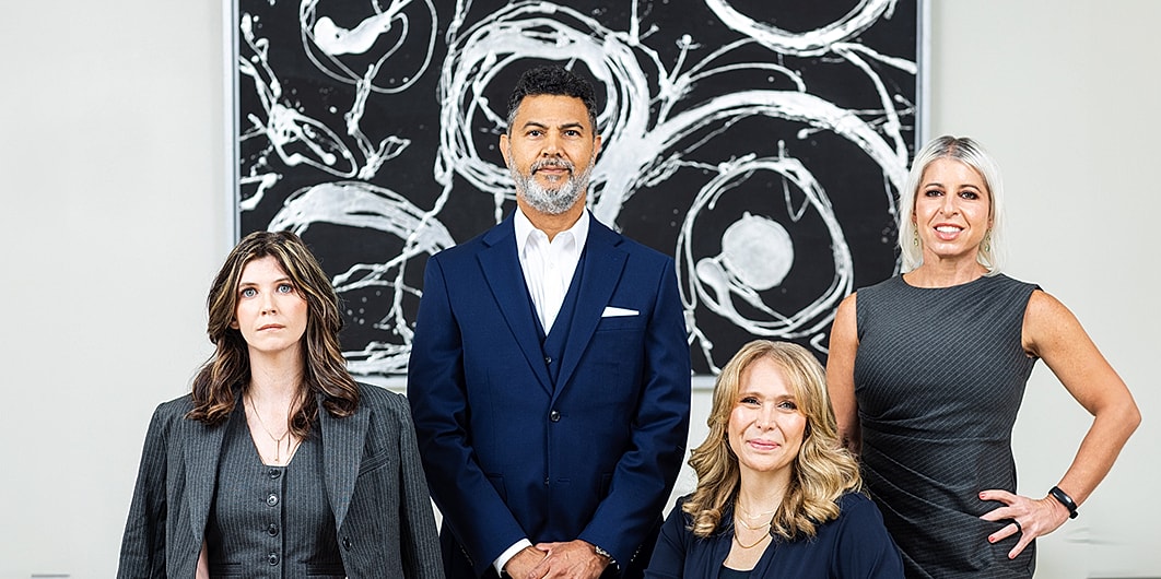 Person walking down stairs in white sneakers.
