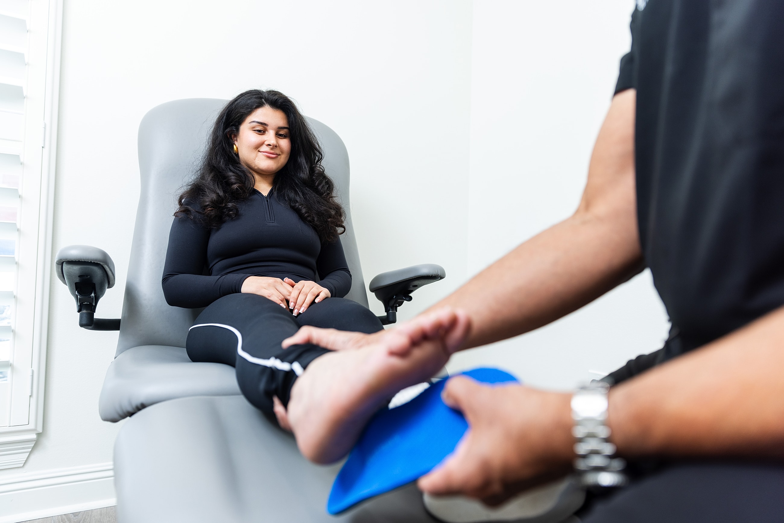 Foot examination in a medical setting.