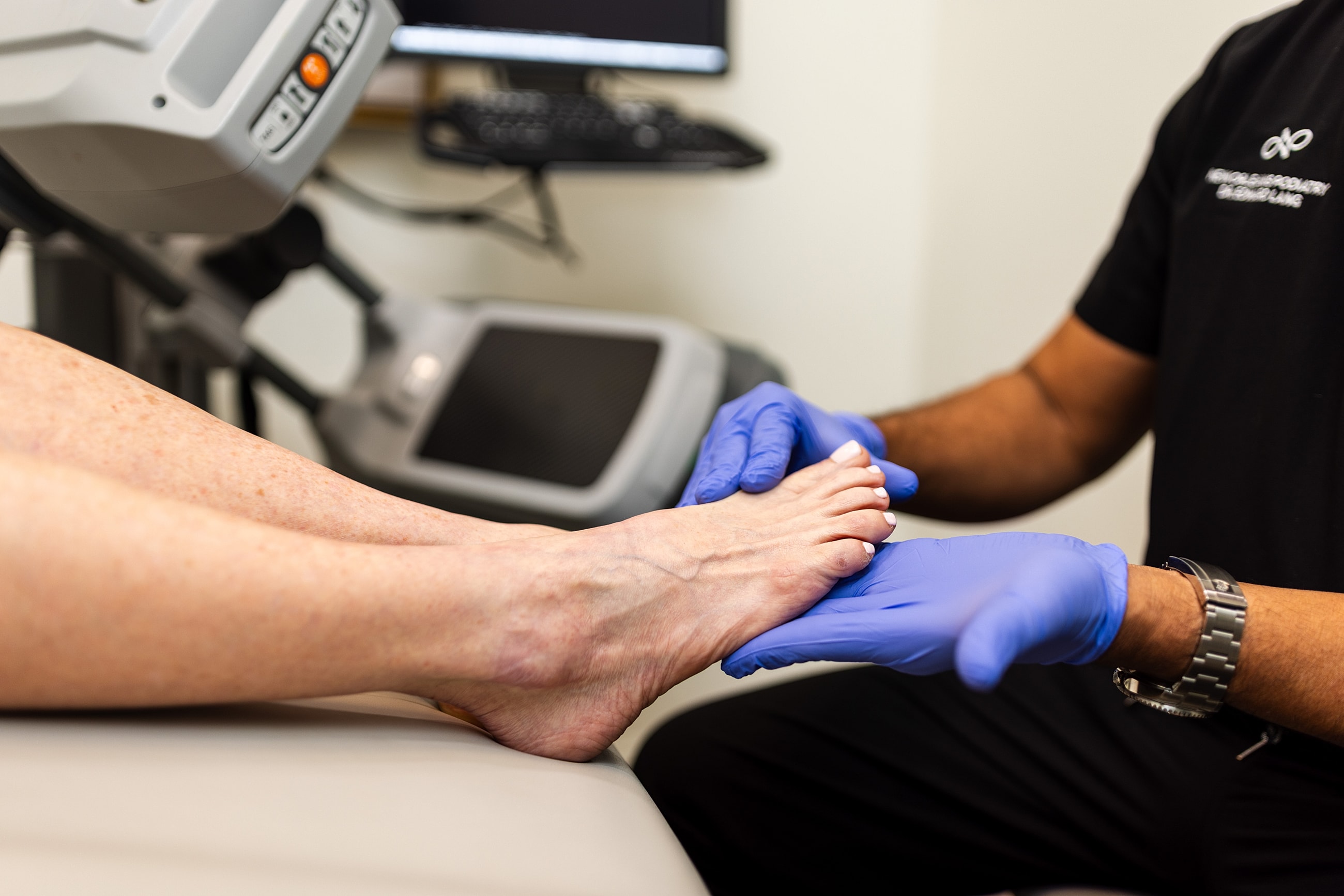 Foot examination by healthcare professional with gloves.