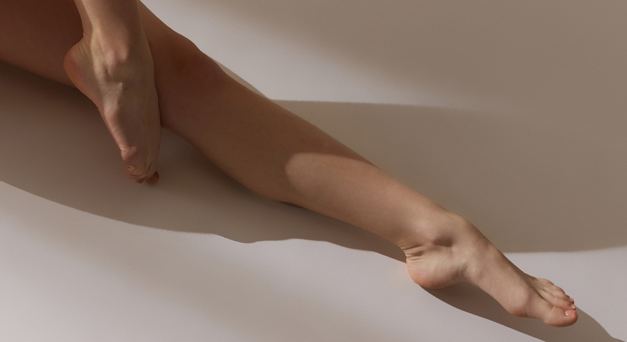 Elegant legs with soft shadows and skin tones.