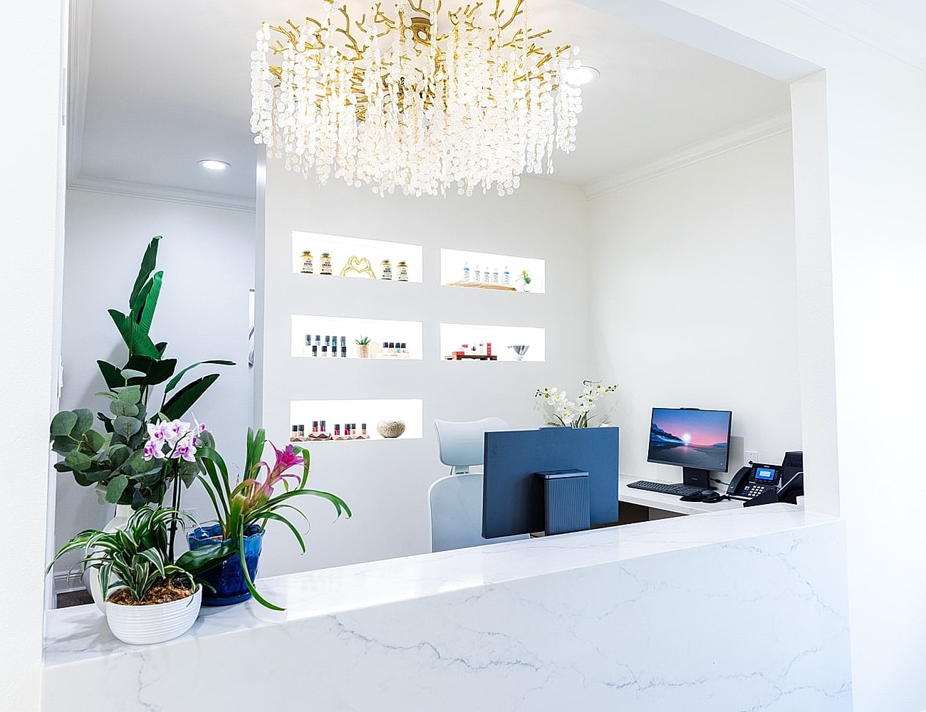 Smiling woman with wavy hair and blue eyes.